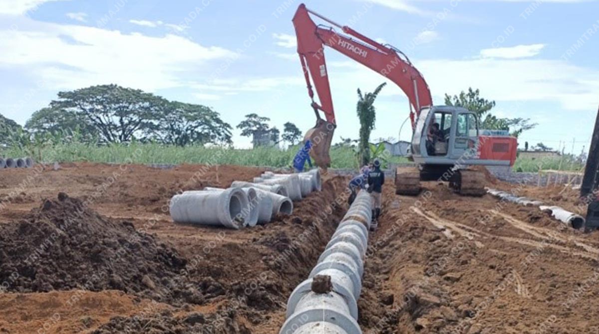 pemasangan pipa beton bertulang